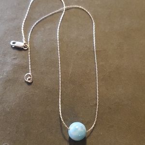 Silver necklace with blue stone